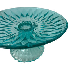 A vibrant aqua blue pressed glass footed dish with a diamond pattern, versatile for serving desserts, fruit, or candy, mid-century design.