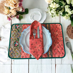 Provence cotton napkins featuring a rust orange background with red and yellow floral designs from Marat d’Avignon Tradition Collection, made of 100% cotton, measuring 18" x 18", with vibrant, fade-resistant prints. Made in France.