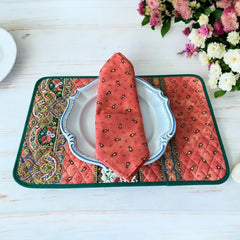 Provence cotton napkins featuring a rust orange background with red and yellow floral designs from Marat d’Avignon Tradition Collection, made of 100% cotton, measuring 18" x 18", with vibrant, fade-resistant prints. Made in France.