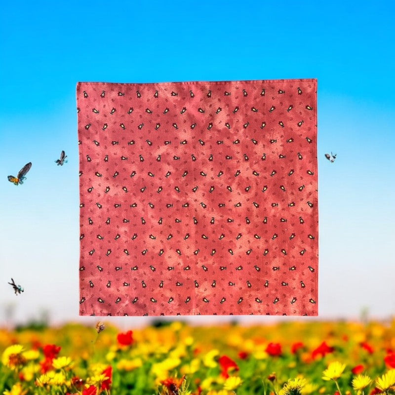 Provence cotton napkins featuring a rust orange background with red and yellow floral designs from Marat d’Avignon Tradition Collection, made of 100% cotton, measuring 18" x 18", with vibrant, fade-resistant prints. Made in France.