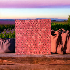 Provence cotton napkins featuring a rust orange background with red and yellow floral designs from Marat d’Avignon Tradition Collection, made of 100% cotton, measuring 18" x 18", with vibrant, fade-resistant prints. Made in France.