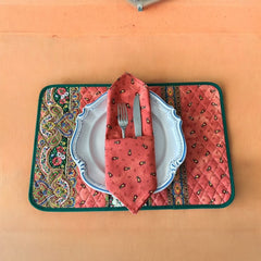 Provence cotton napkins featuring a rust orange background with red and yellow floral designs from Marat d’Avignon Tradition Collection, made of 100% cotton, measuring 18" x 18", with vibrant, fade-resistant prints. Made in France.