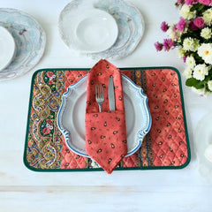 Provence cotton napkins featuring a rust orange background with red and yellow floral designs from Marat d’Avignon Tradition Collection, made of 100% cotton, measuring 18" x 18", with vibrant, fade-resistant prints. Made in France.