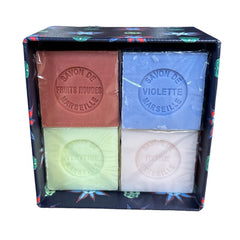Gift box featuring a charming Moon and Sun design on a midnight blue background. Contains four artisanal Marseille cube soaps in Violet, Rose, Verbena, and Red Berries fragrances.