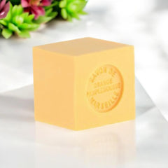 Mini Marseille soap with orange and grapefruit scent, crafted in France using traditional craftsmanship, 3.5 oz natural and biodegradable soap bar for sensitive skin.