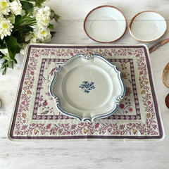 Provence Jacquard Montespan Collection placemat from Tissus Toselli, featuring a pink floral design on a cream-colored background, woven with intricate patterns inspired by old Provencal fabrics, measuring 19" x 15", photographed showcasing its elegant and refined craftsmanship
