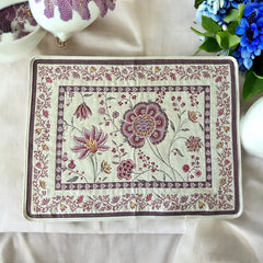 Provence Jacquard Montespan Collection placemat from Tissus Toselli, featuring a pink floral design on a cream-colored background, woven with intricate patterns inspired by old Provencal fabrics, measuring 19" x 15", photographed showcasing its elegant and refined craftsmanship