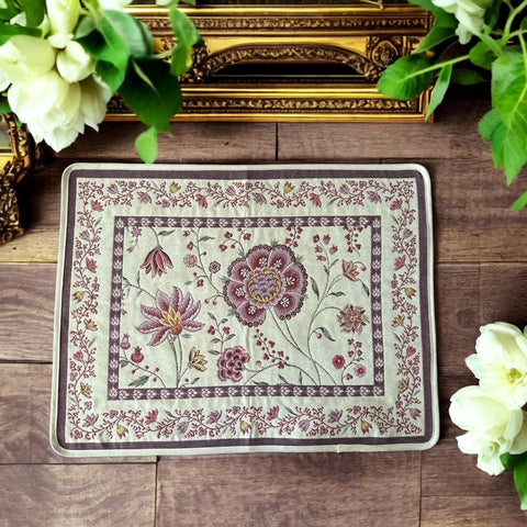 Provence Jacquard Montespan Collection placemat from Tissus Toselli, featuring a pink floral design on a cream-colored background, woven with intricate patterns inspired by old Provencal fabrics, measuring 19" x 15", photographed showcasing its elegant and refined craftsmanship