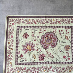 Provence Jacquard Montespan Collection placemat from Tissus Toselli, featuring a pink floral design on a cream-colored background, woven with intricate patterns inspired by old Provencal fabrics, measuring 19" x 15", photographed showcasing its elegant and refined craftsmanship