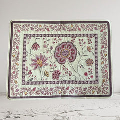 Provence Jacquard Montespan Collection placemat from Tissus Toselli, featuring a pink floral design on a cream-colored background, woven with intricate patterns inspired by old Provencal fabrics, measuring 19" x 15", photographed showcasing its elegant and refined craftsmanship