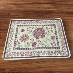 Provence Jacquard Montespan Collection placemat from Tissus Toselli, featuring a pink floral design on a cream-colored background, woven with intricate patterns inspired by old Provencal fabrics, measuring 19" x 15", photographed showcasing its elegant and refined craftsmanship