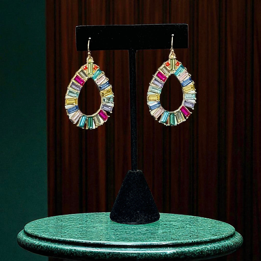 Christian Siriano New York teardrop dangle earrings with multicolor baguette-cut cubic zirconia stones in a vibrant, symmetrical design.