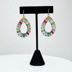 Christian Siriano New York teardrop dangle earrings with multicolor baguette-cut cubic zirconia stones in a vibrant, symmetrical design.