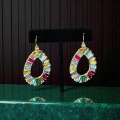 Christian Siriano New York teardrop dangle earrings with multicolor baguette-cut cubic zirconia stones in a vibrant, symmetrical design.