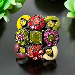 Adjustable brass ring with multicolor enamel leaves and rhinestone floral motifs, featuring vibrant hues of red, pink, green, purple, moss green, cream, and yellow, in very good second-hand condition.