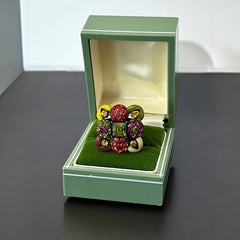 Adjustable brass ring with multicolor enamel leaves and rhinestone floral motifs, featuring vibrant hues of red, pink, green, purple, moss green, cream, and yellow, in very good second-hand condition.