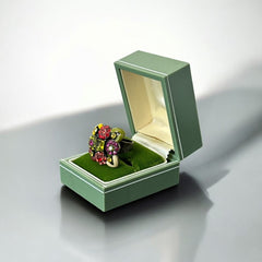 Adjustable brass ring with multicolor enamel leaves and rhinestone floral motifs, featuring vibrant hues of red, pink, green, purple, moss green, cream, and yellow, in very good second-hand condition.