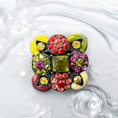 Adjustable brass ring with multicolor enamel leaves and rhinestone floral motifs, featuring vibrant hues of red, pink, green, purple, moss green, cream, and yellow, in very good second-hand condition.