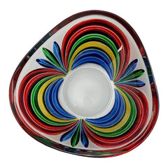 A small, triangular vintage Murano glass trinket dish from the 1990s, featuring vibrant red, green, blue, and yellow colors. The multicolored Venetian glass dish has a tiny chip on the rim but remains a striking and functional decorative piece.