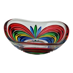 A small, triangular vintage Murano glass trinket dish from the 1990s, featuring vibrant red, green, blue, and yellow colors. The multicolored Venetian glass dish has a tiny chip on the rim but remains a striking and functional decorative piece.