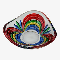 A small, triangular vintage Murano glass trinket dish from the 1990s, featuring vibrant red, green, blue, and yellow colors. The multicolored Venetian glass dish has a tiny chip on the rim but remains a striking and functional decorative piece.