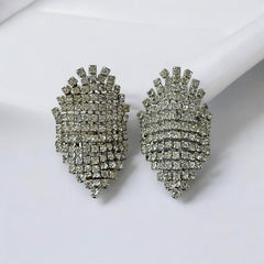 Pair of vintage 1950s Musi clear rhinestone chain shoe clips with an elongated shape, featuring triangular details at the top and bottom. The top rhinestone chains are soldered, while the bottom section moves for added sparkle. Signed 'Musi' on the back, in very good vintage condition with one slightly darkened rhinestone.