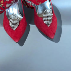 Pair of vintage 1950s Musi clear rhinestone chain shoe clips with an elongated shape, featuring triangular details at the top and bottom. The top rhinestone chains are soldered, while the bottom section moves for added sparkle. Signed 'Musi' on the back, in very good vintage condition with one slightly darkened rhinestone.