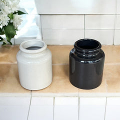 French stoneware jar from Meaux in excellent condition, available in off-white natural or black color, featuring a rustic and versatile design suitable for holding utensils, fresh herbs, small bouquets, storing food, or as a cooking salt cellar.