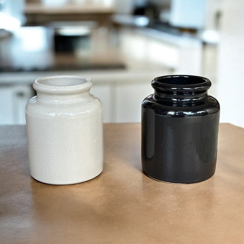 French stoneware jar from Meaux in excellent condition, available in off-white natural or black color, featuring a rustic and versatile design suitable for holding utensils, fresh herbs, small bouquets, storing food, or as a cooking salt cellar.