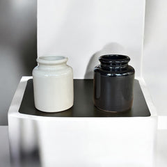 French stoneware jar from Meaux in excellent condition, available in off-white natural or black color, featuring a rustic and versatile design suitable for holding utensils, fresh herbs, small bouquets, storing food, or as a cooking salt cellar.