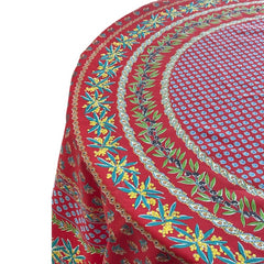 Round Provence-style cotton tablecloth by Le Cluny, featuring a vibrant red background with yellow mimosa and black olive detailing. Measures 70 inches in diameter, made in France, suitable for indoor and outdoor use, and machine washable for easy care.