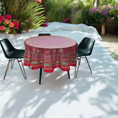 Round Provence-style cotton tablecloth by Le Cluny, featuring a vibrant red background with yellow mimosa and black olive detailing. Measures 70 inches in diameter, made in France, suitable for indoor and outdoor use, and machine washable for easy care.