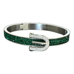 Emerald and clear rhinestone hinged bangle bracelet made of polished stainless steel with a modern belt buckle design, featuring sparkling accents and marked 316L S.Steel, photographed in excellent condition.