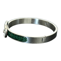 Emerald and clear rhinestone hinged bangle bracelet made of polished stainless steel with a modern belt buckle design, featuring sparkling accents and marked 316L S.Steel, photographed in excellent condition.