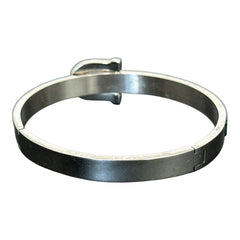 Emerald and clear rhinestone hinged bangle bracelet made of polished stainless steel with a modern belt buckle design, featuring sparkling accents and marked 316L S.Steel, photographed in excellent condition.