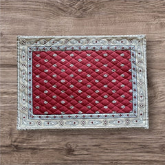 Reversible quilted cotton placemat in Bastide Red Grey by Marat d’Avignon, featuring a deep red floral diamond motif with ornate grey paisley borders on the front, and a delicate red-and-white floral pattern on the reverse, crafted in Provence.