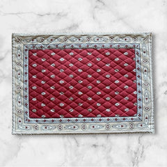 Reversible quilted cotton placemat in Bastide Red Grey by Marat d’Avignon, featuring a deep red floral diamond motif with ornate grey paisley borders on the front, and a delicate red-and-white floral pattern on the reverse, crafted in Provence.