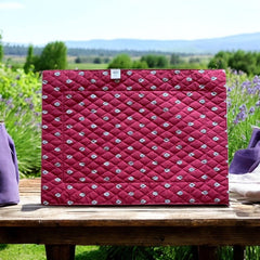 Reversible quilted cotton placemat in Bastide Red Grey by Marat d’Avignon, featuring a deep red floral diamond motif with ornate grey paisley borders on the front, and a delicate red-and-white floral pattern on the reverse, crafted in Provence.