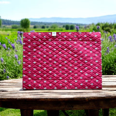 Reversible quilted cotton placemat in Bastide Red Grey by Marat d’Avignon, featuring a deep red floral diamond motif with ornate grey paisley borders on the front, and a delicate red-and-white floral pattern on the reverse, crafted in Provence.