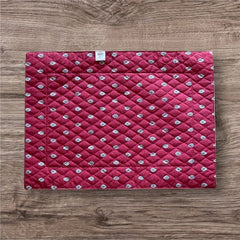 Reversible quilted cotton placemat in Bastide Red Grey by Marat d’Avignon, featuring a deep red floral diamond motif with ornate grey paisley borders on the front, and a delicate red-and-white floral pattern on the reverse, crafted in Provence.