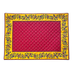 Reversible quilted cotton placemat in Fleurette Red Yellow by Marat d’Avignon, featuring a red diamond-quilted center with petite golden florals and yellow floral scroll borders on the front, and an allover red reverse with golden diamond accents, crafted in Provence.