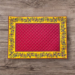 Reversible quilted cotton placemat in Fleurette Red Yellow by Marat d’Avignon, featuring a red diamond-quilted center with petite golden florals and yellow floral scroll borders on the front, and an allover red reverse with golden diamond accents, crafted in Provence.