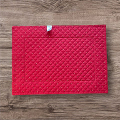 Reversible quilted cotton placemat in Fleurette Red Yellow by Marat d’Avignon, featuring a red diamond-quilted center with petite golden florals and yellow floral scroll borders on the front, and an allover red reverse with golden diamond accents, crafted in Provence.