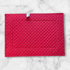 Reversible quilted cotton placemat in Fleurette Red Yellow by Marat d’Avignon, featuring a red diamond-quilted center with petite golden florals and yellow floral scroll borders on the front, and an allover red reverse with golden diamond accents, crafted in Provence.