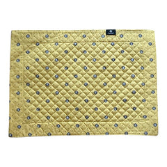 Reversible quilted cotton placemat in Lauris Light Yellow by Marat d’Avignon, featuring a pale yellow center with blue floral medallions and a border of lavender sprigs and olive branches, with a reverse side of soft yellow scattered with tiny blue and white blossoms, crafted in Provence.
