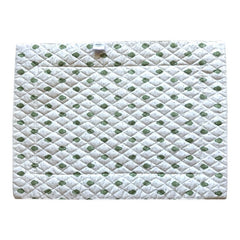 Reversible quilted cotton placemat in Bastide Green by Marat d’Avignon, featuring an ivory background with green floral medallions and scrolling vine borders on the front, and a white reverse with scattered green floral sprigs, crafted in Provence.