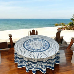 Round Provence-style cotton tablecloth by Le Cluny, featuring a blue and white floral design inspired by French elegance. Coated for easy cleaning, measures 70 inches in diameter, perfect for indoor and outdoor use.