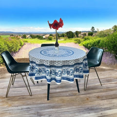 Round Provence-style cotton tablecloth by Le Cluny, featuring a blue and white floral design inspired by French elegance. Coated for easy cleaning, measures 70 inches in diameter, perfect for indoor and outdoor use.