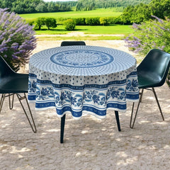 Round Provence-style cotton tablecloth by Le Cluny, featuring a blue and white floral design inspired by French elegance. Coated for easy cleaning, measures 70 inches in diameter, perfect for indoor and outdoor use.