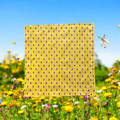 Provence cotton napkins featuring a yellow background with blue and yellow floral designs, part of the Avignon Collection from Marat d’Avignon made of 100% cotton, measuring 18" x 18", with vibrant, fade-resistant prints. Made in France.